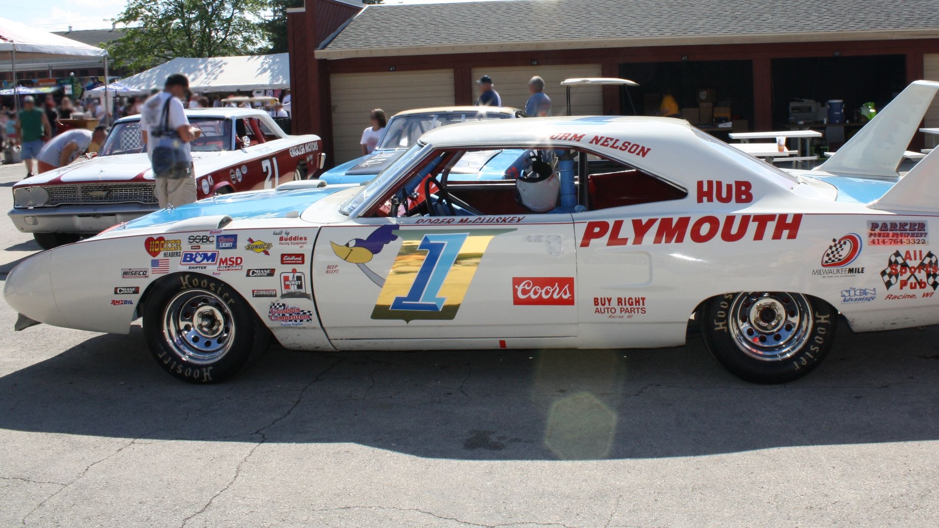 A Plymouth w:USAC Stock Car or replica on display at the 2009 NASCAR Nationwide race at the w:Milwaukee Mile. Owned by w:Norm Nelson and driven by w:Roger McCluskey