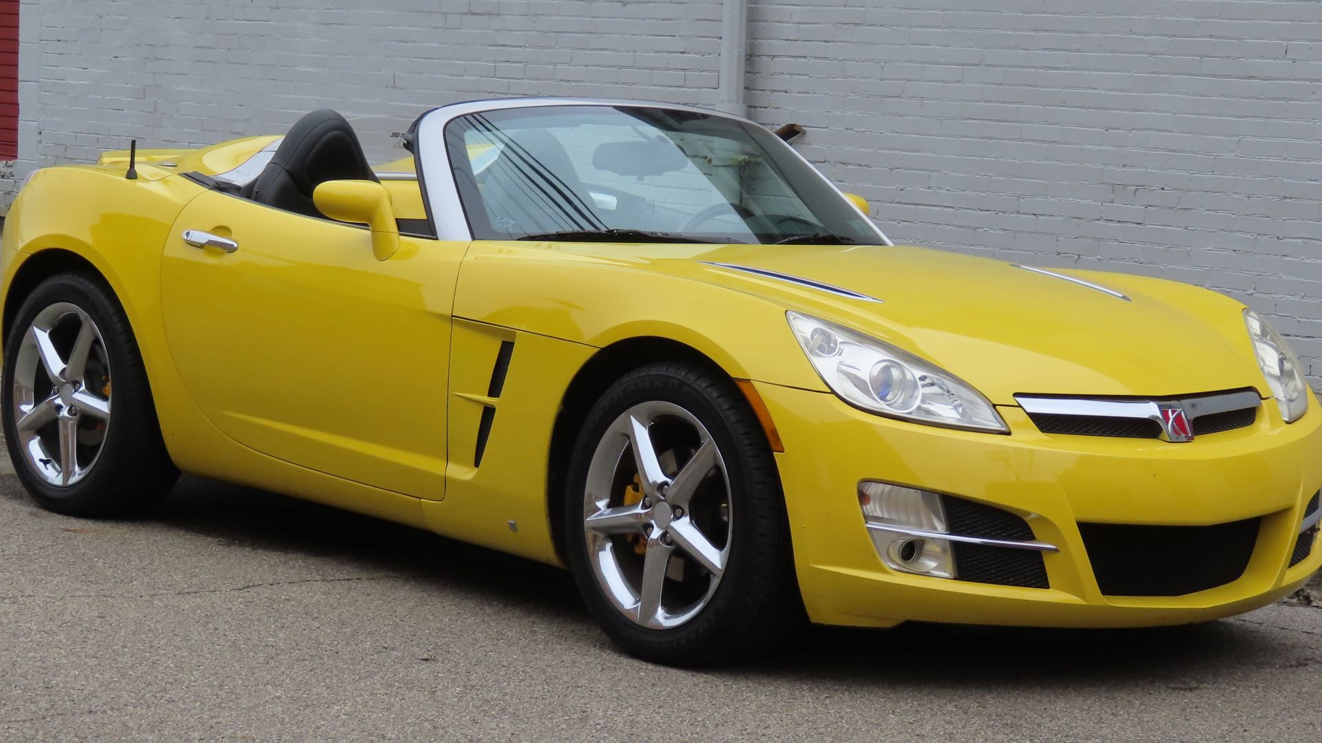 2007 Saturn Sky photographed in New Brighton, Pennsylvania. Finished in Sunburst Yellow.