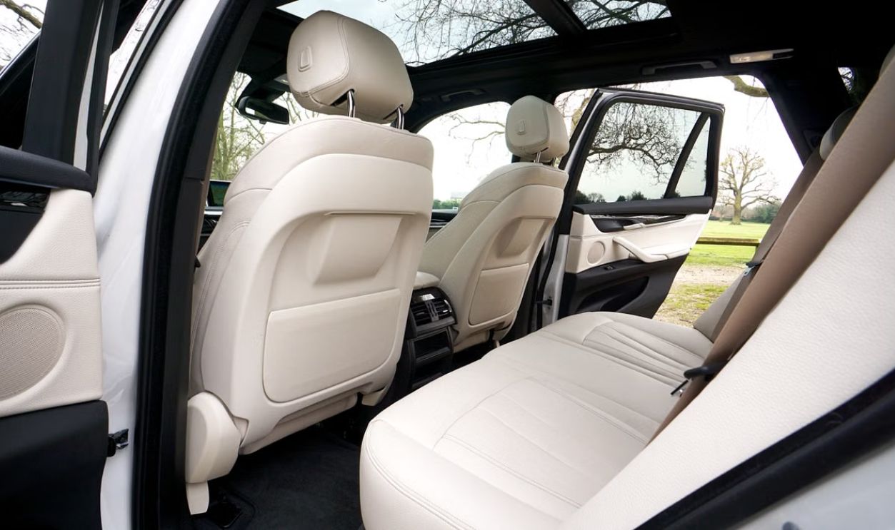 Explore the spacious and luxurious interior of a BMW SUV, featuring leather seats and a sunroof