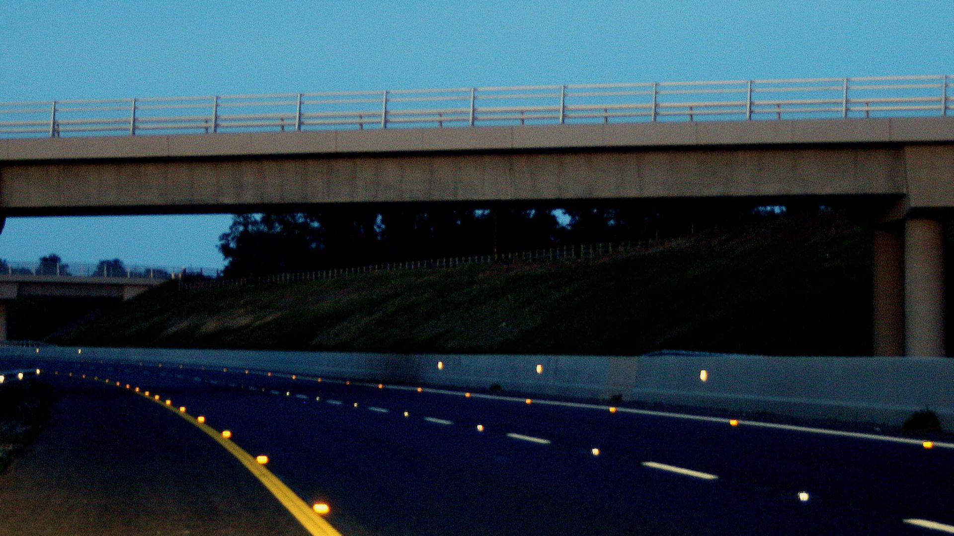 M9 Motorway in Co. Carlow, Ireland
Late evening photo modified (darker, high contrast) to highlight cats eyes/retroreflectors