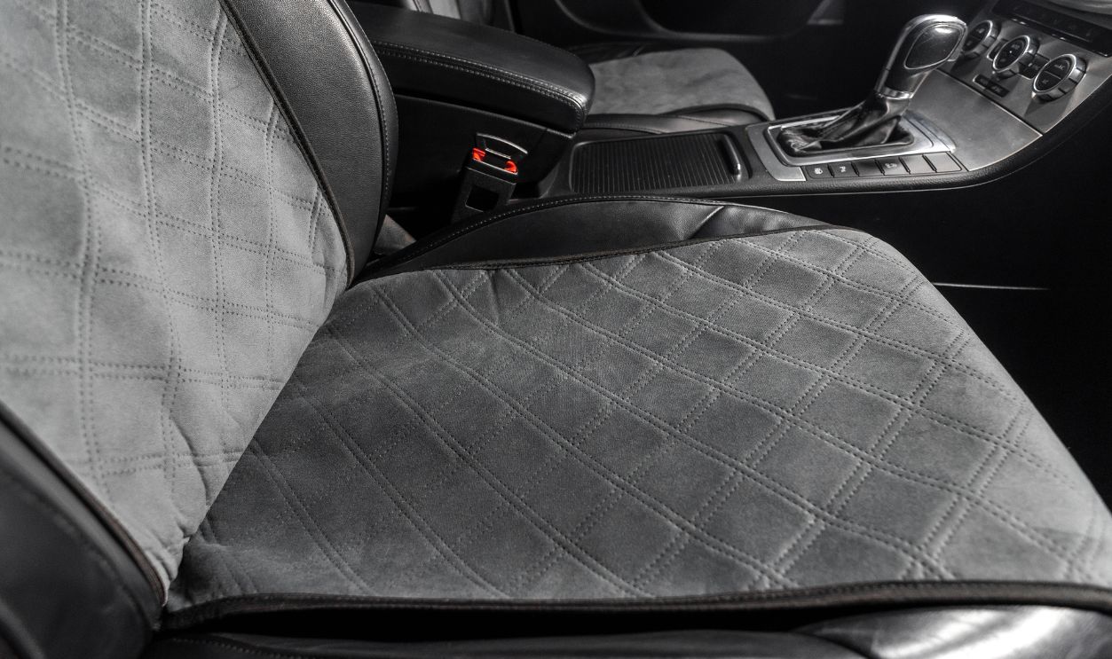 fabric seat cover in a car in a black interior