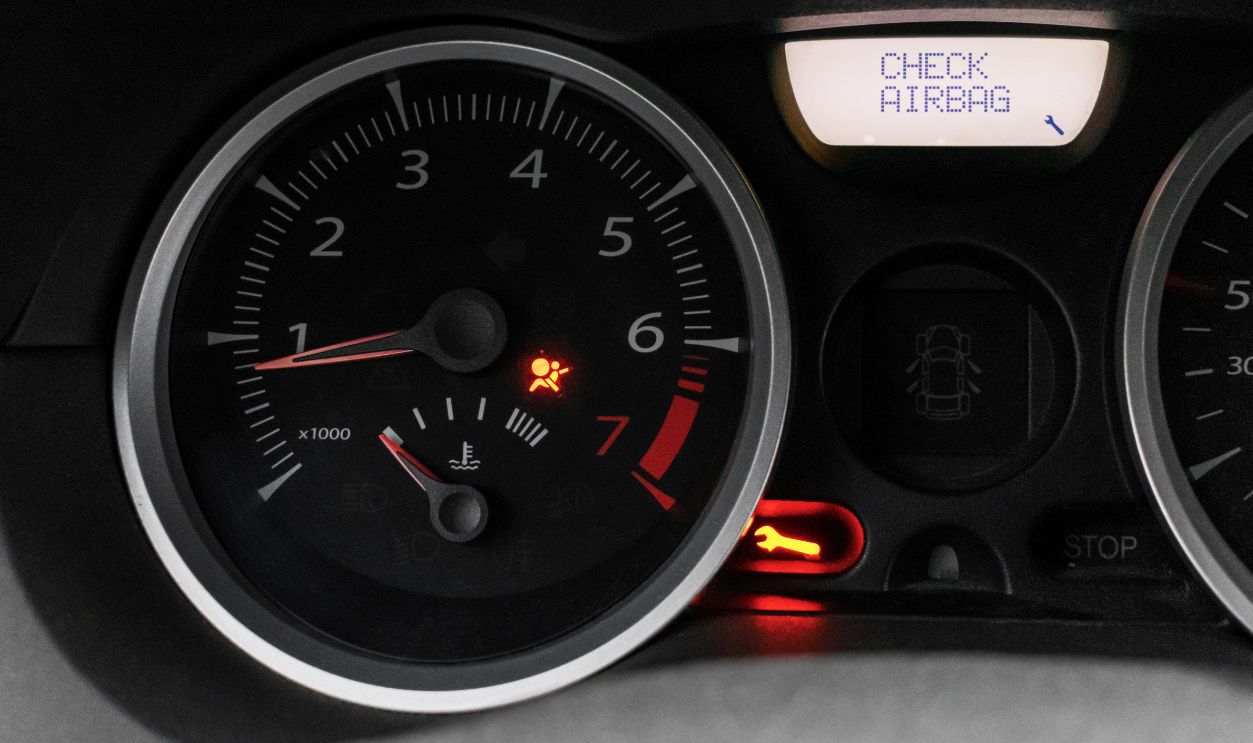 Car dashboard with airbag error warning, malfunction. Car service and repair. The dashboard is close.