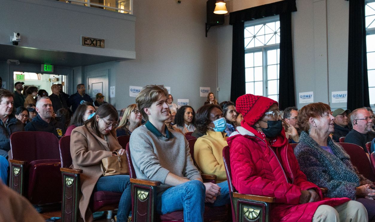 A diverse group of people attending a community meeting in Seattle