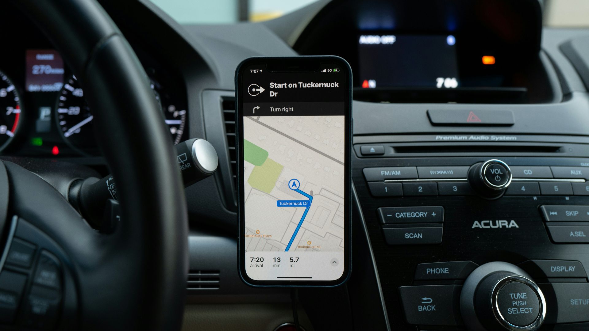 black android smartphone on car center console