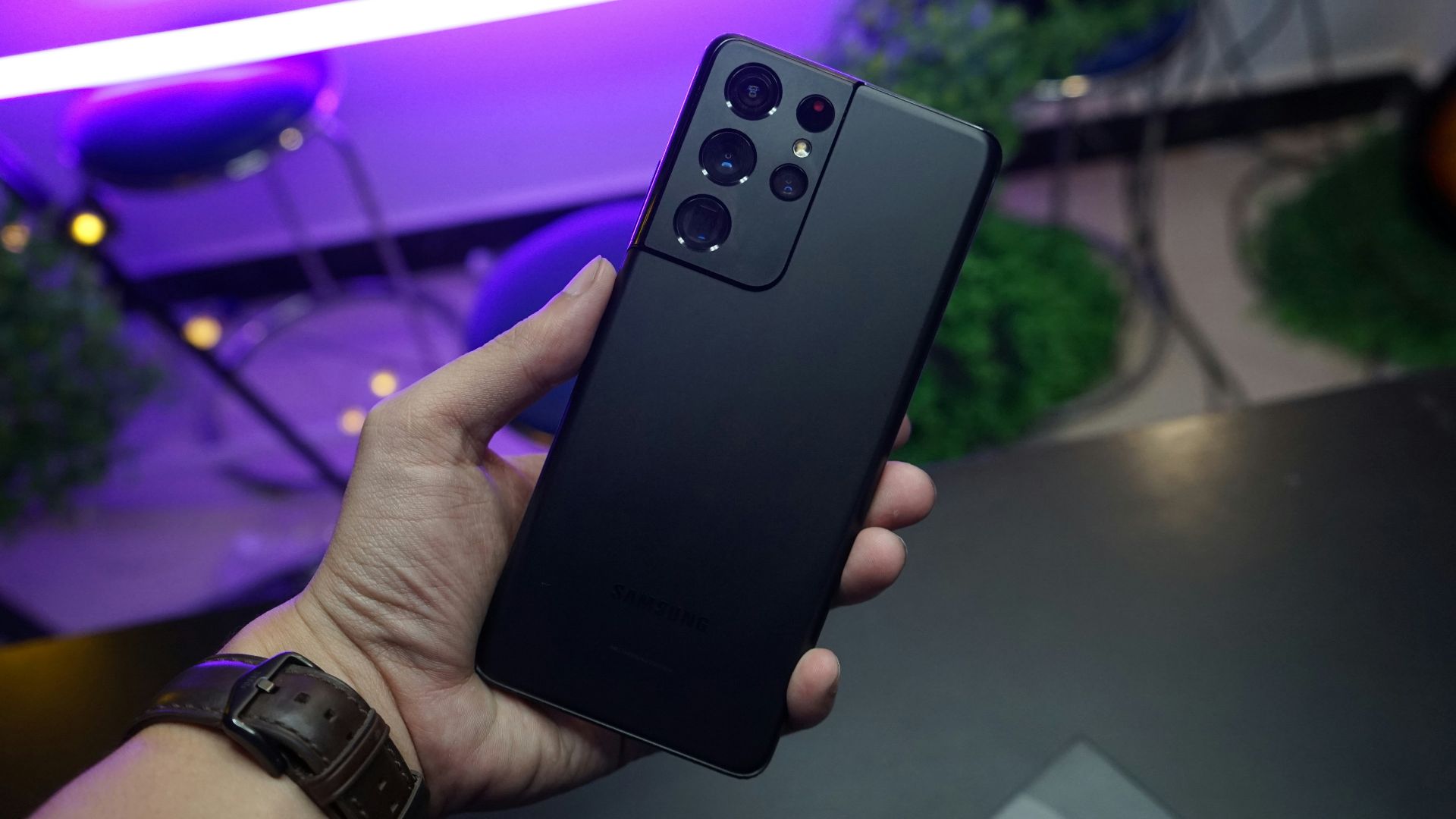 person holding black remote control