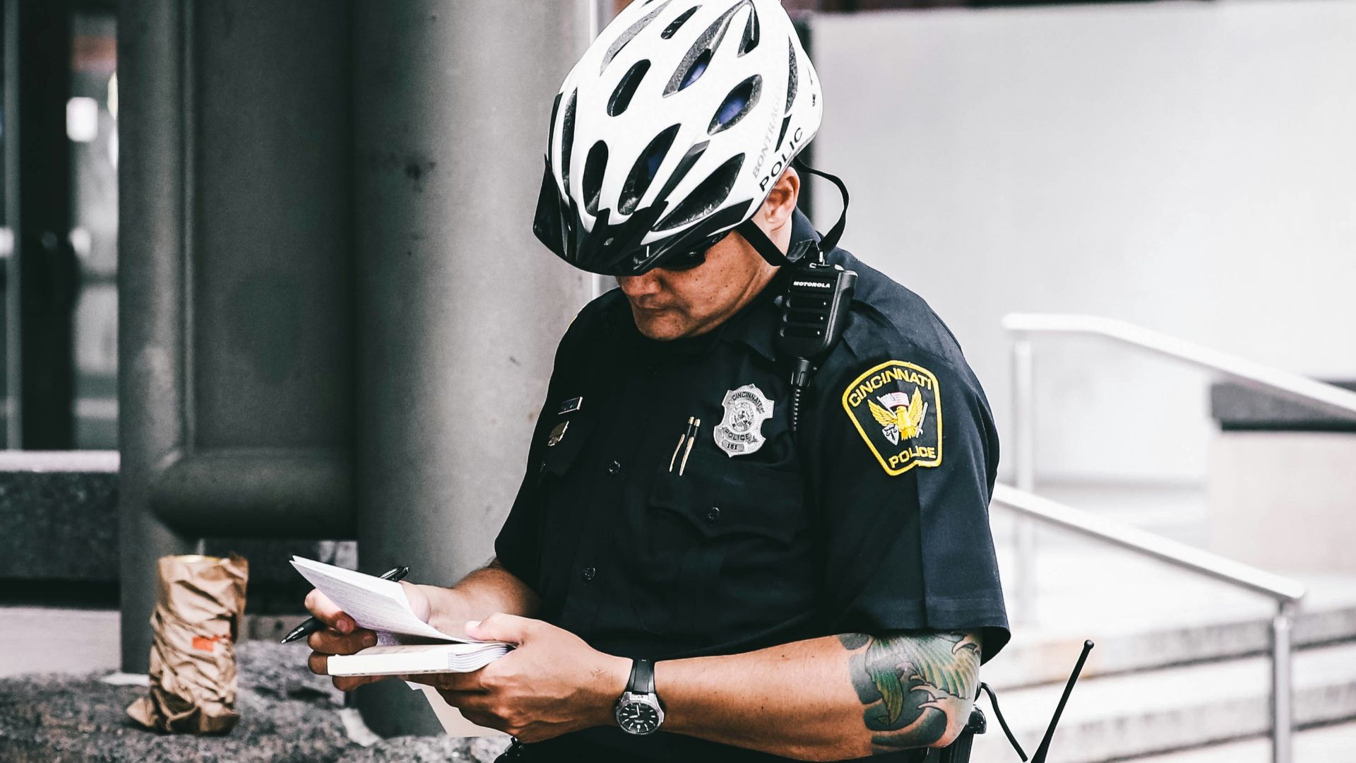 officer reading notes