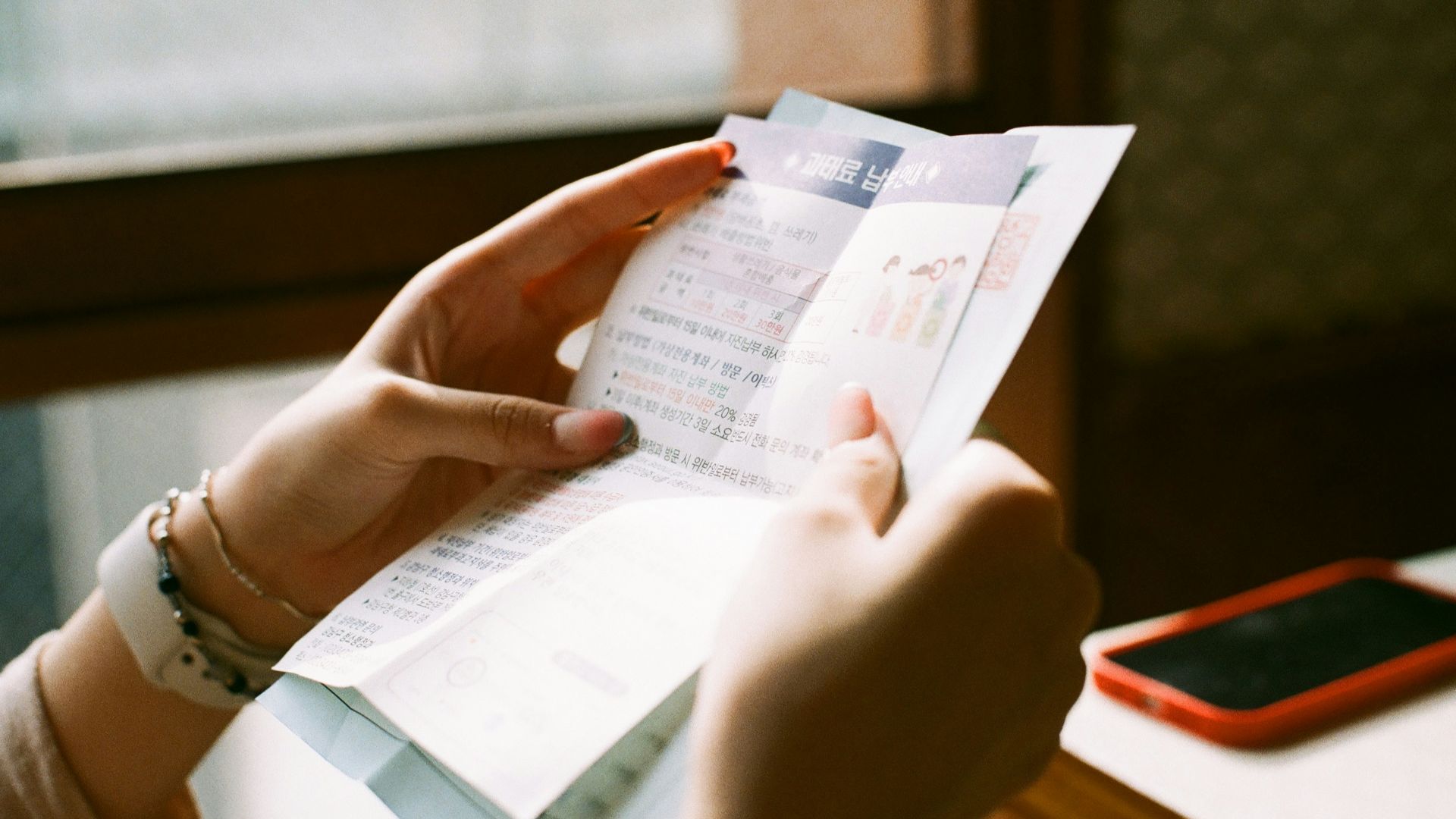 person holding white printer paper