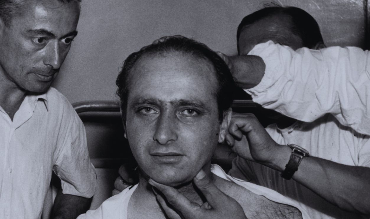 Gettyimages - 3431929, A Pain In The Neck 8th September 1952: Doctors examing the Argentinian racing driver, Juan Fangio, after removing the plaster from around his neck at Monza Hospital. Fangio had broken his neck in a crash the year before. 