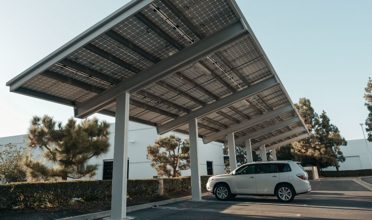 Solar panel carport in a modern urban setting, showcasing clean energy