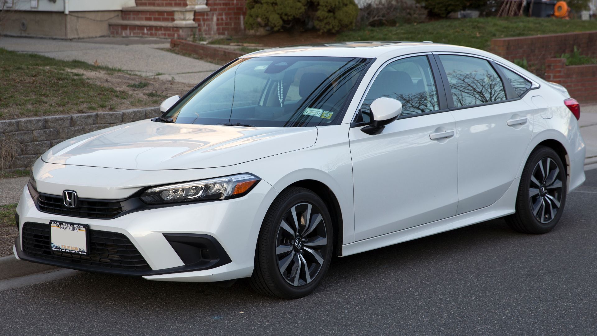 2022 Honda Civic Sedan EX in Platinum White Pearl; 1.5-liter turbo four with 180hp and CVT transmission.