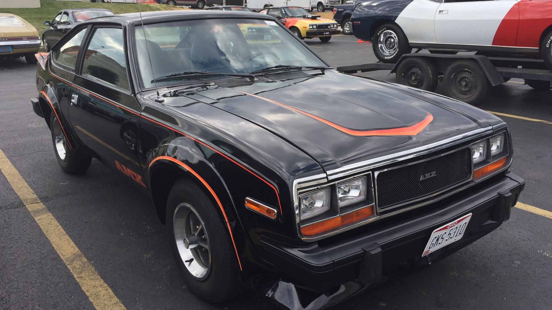 1979 AMC Spirit AMX, a sports subcompact car built by American Motors Corporation (AMC). This car has a V8 engine. It also features a custom upper bodyside stripe, accents on the hood and around the tail lamps, modernized headlamps, and special dual exhau