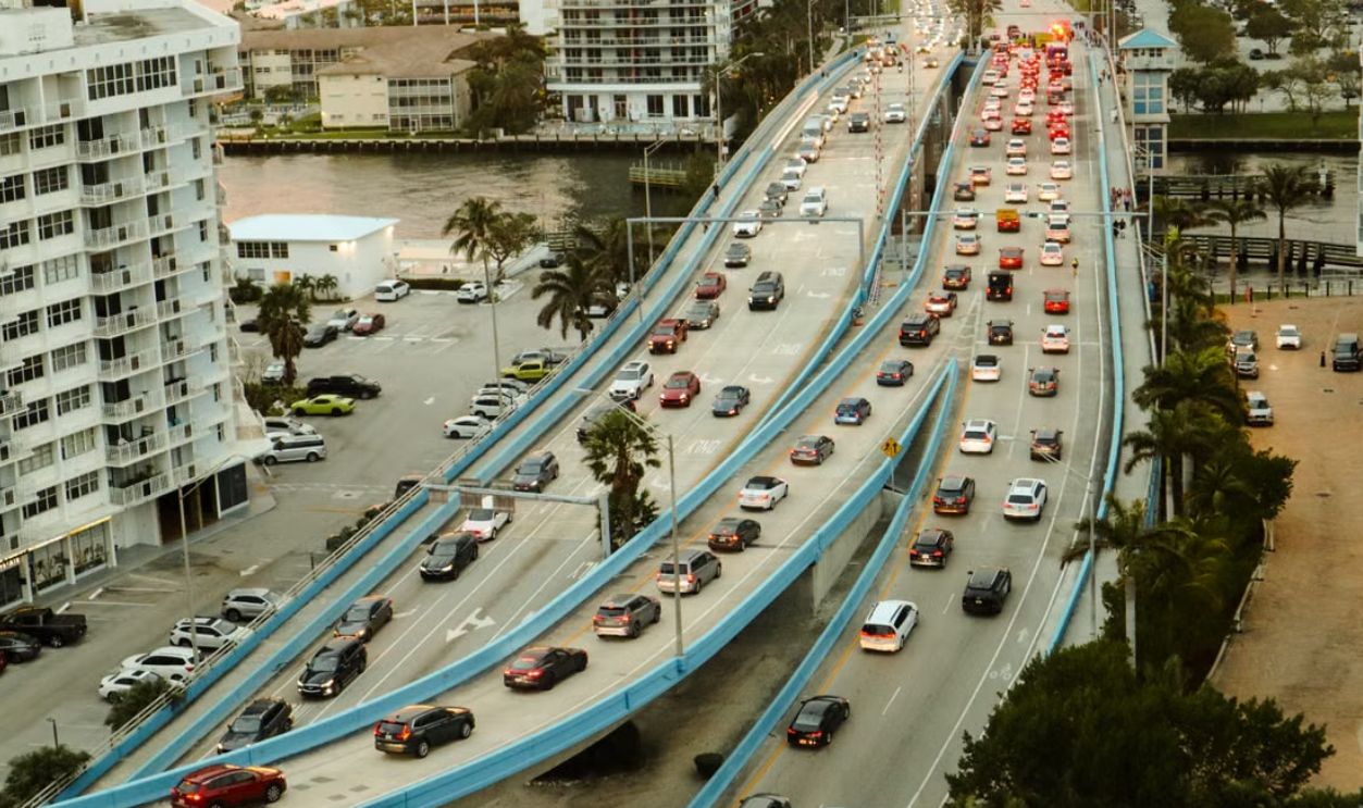 High angle view of urban traffic on a multi-lane road, showcasing city life and infrastructure