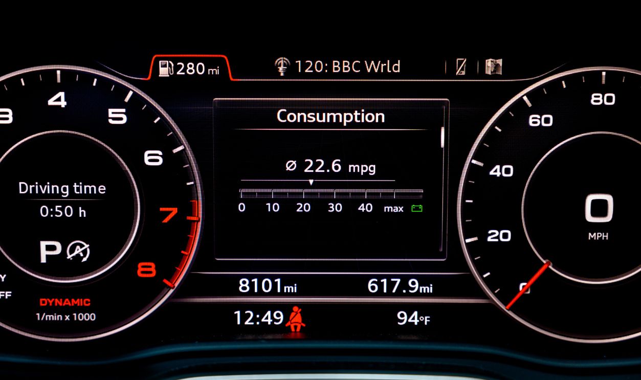 Fuel consumption display in instrument cluster of modern car. Fuel economy is one of the most important factors to consider when buying a new car. Car gas mileage theme, fuel consumption concept