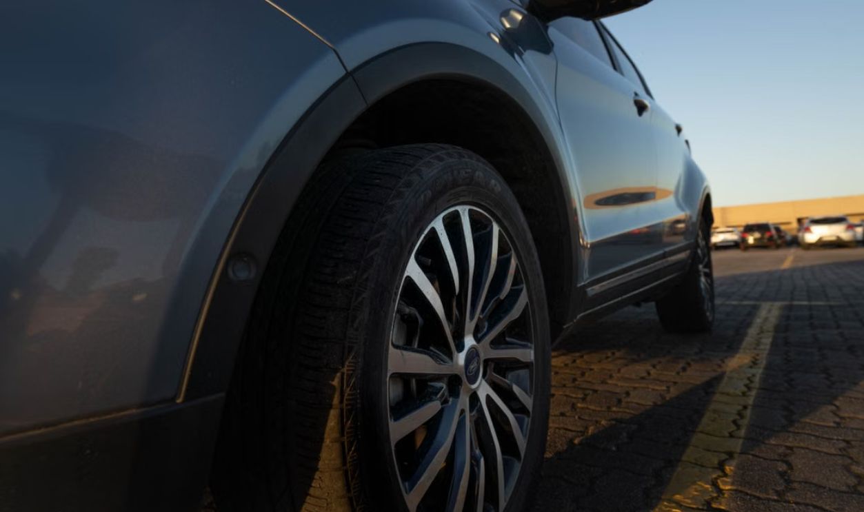 Close-up of a modern car parked in Buenos Aires during sunset, showcasing urban lifestyle
