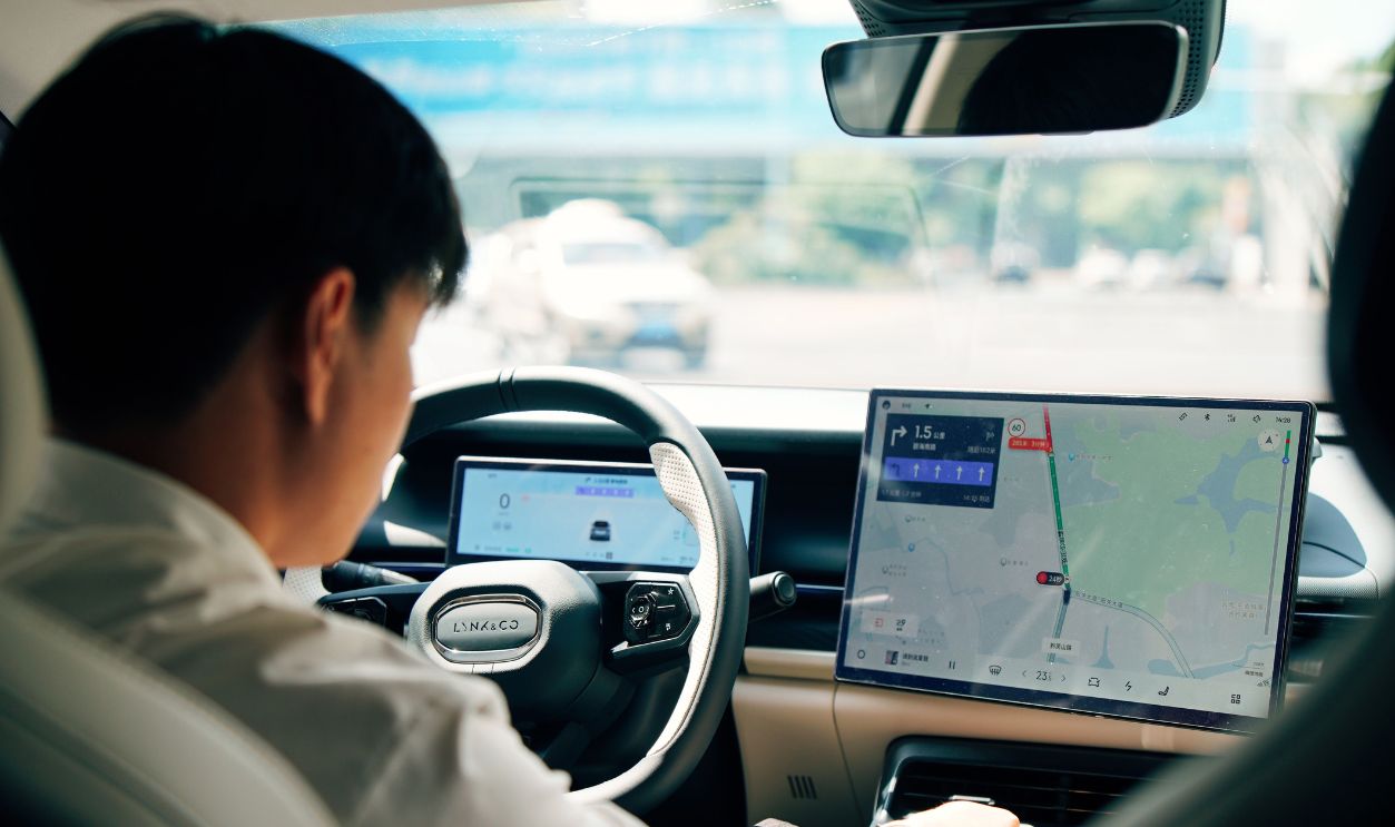 Driver using GPS in a modern car interior. Emphasis on technology
