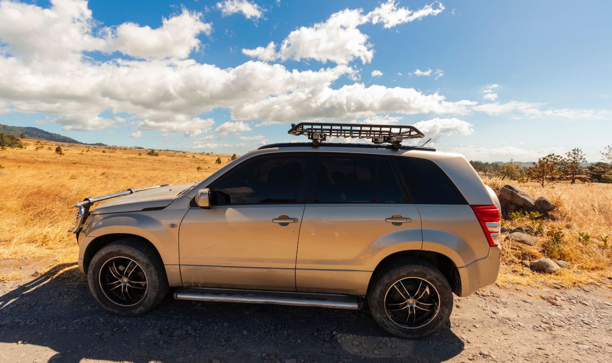 Side view of a silver SUV on a sunny day