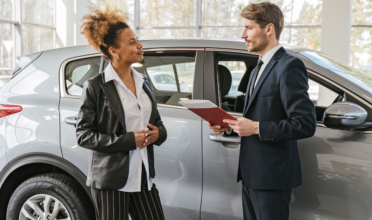 Woman Talking to Car Dealer
