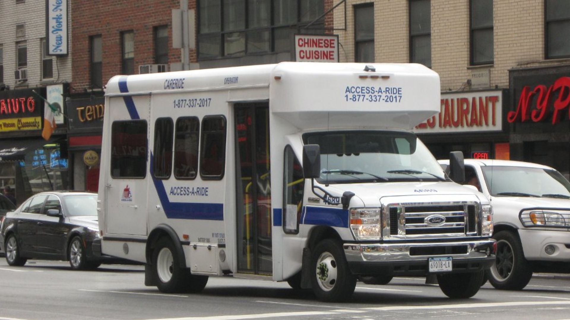 An MTA Access-A-Ride van travels in the vicinity of New York Penn Station.