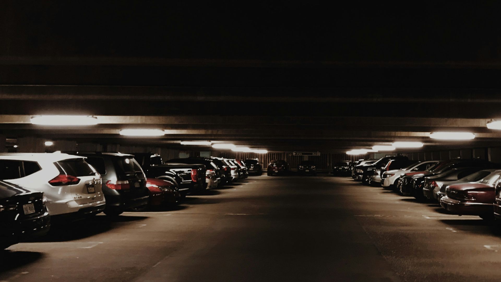 vehicles parked inside parking lot