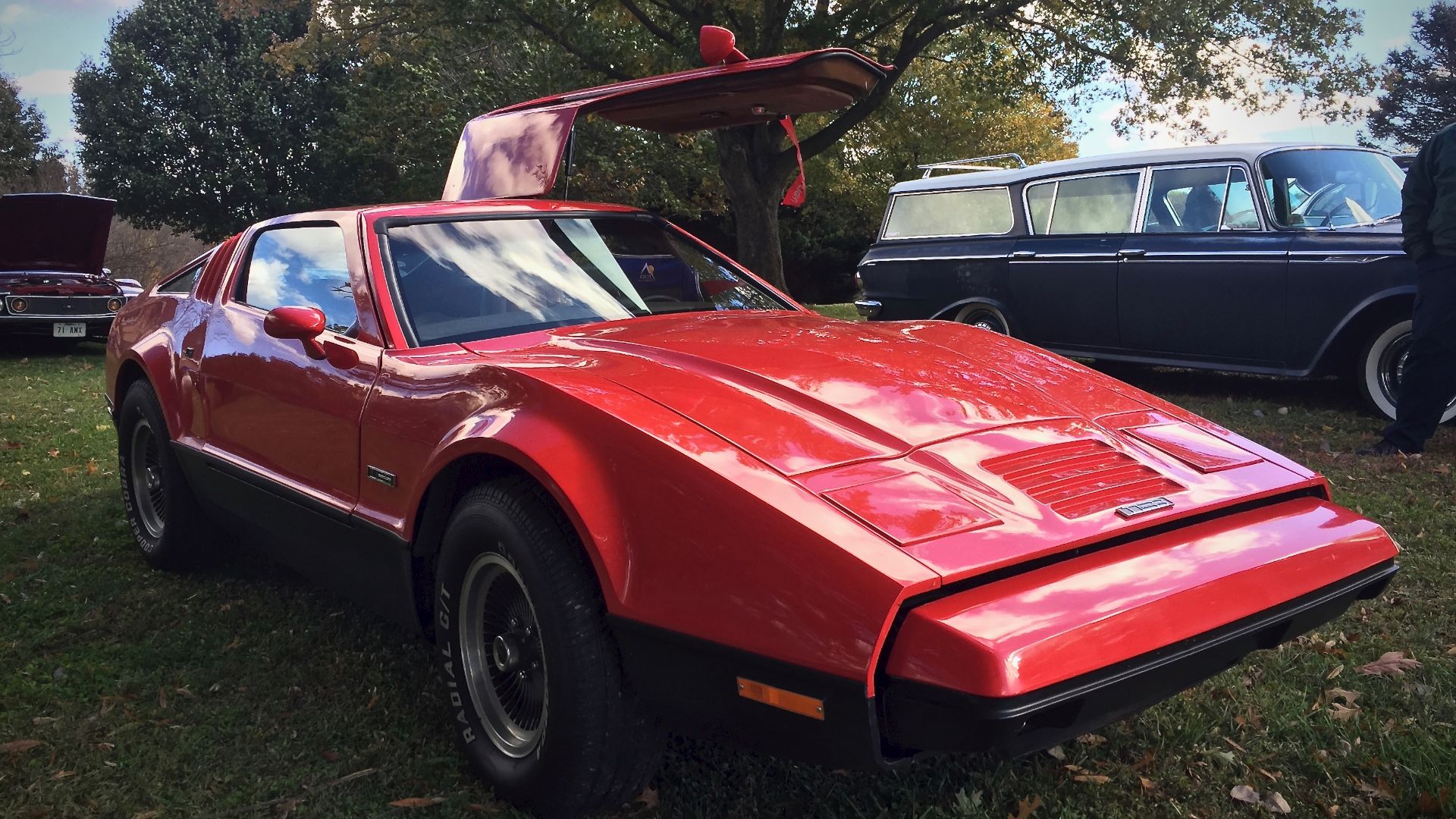 Front right view of a 1974 Bricklin SV-1 sports car. This model features American Motors (AMC) powertrain including the 360 CID (5.9 L) V8 engine and 4-speed manual transmission. The picture was taken at a meeting of the Potomac Ramblers Auto Club in Mary