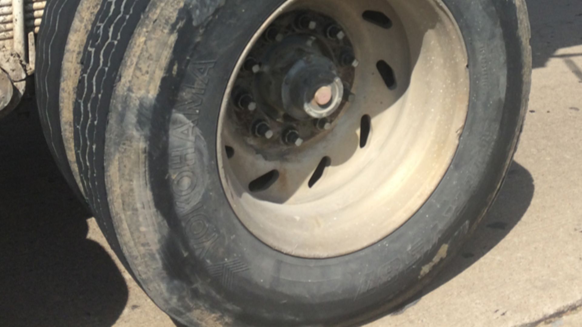 An example of tread separation on a tractor trailer tire while in use.