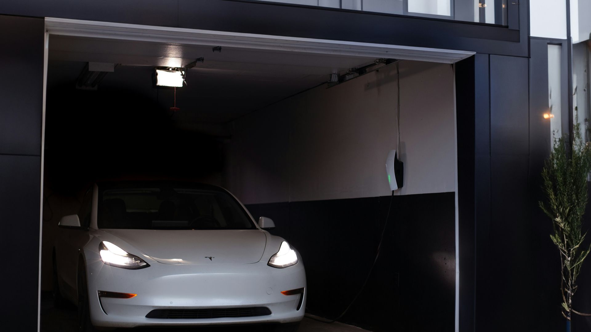 a white car is parked in a garage