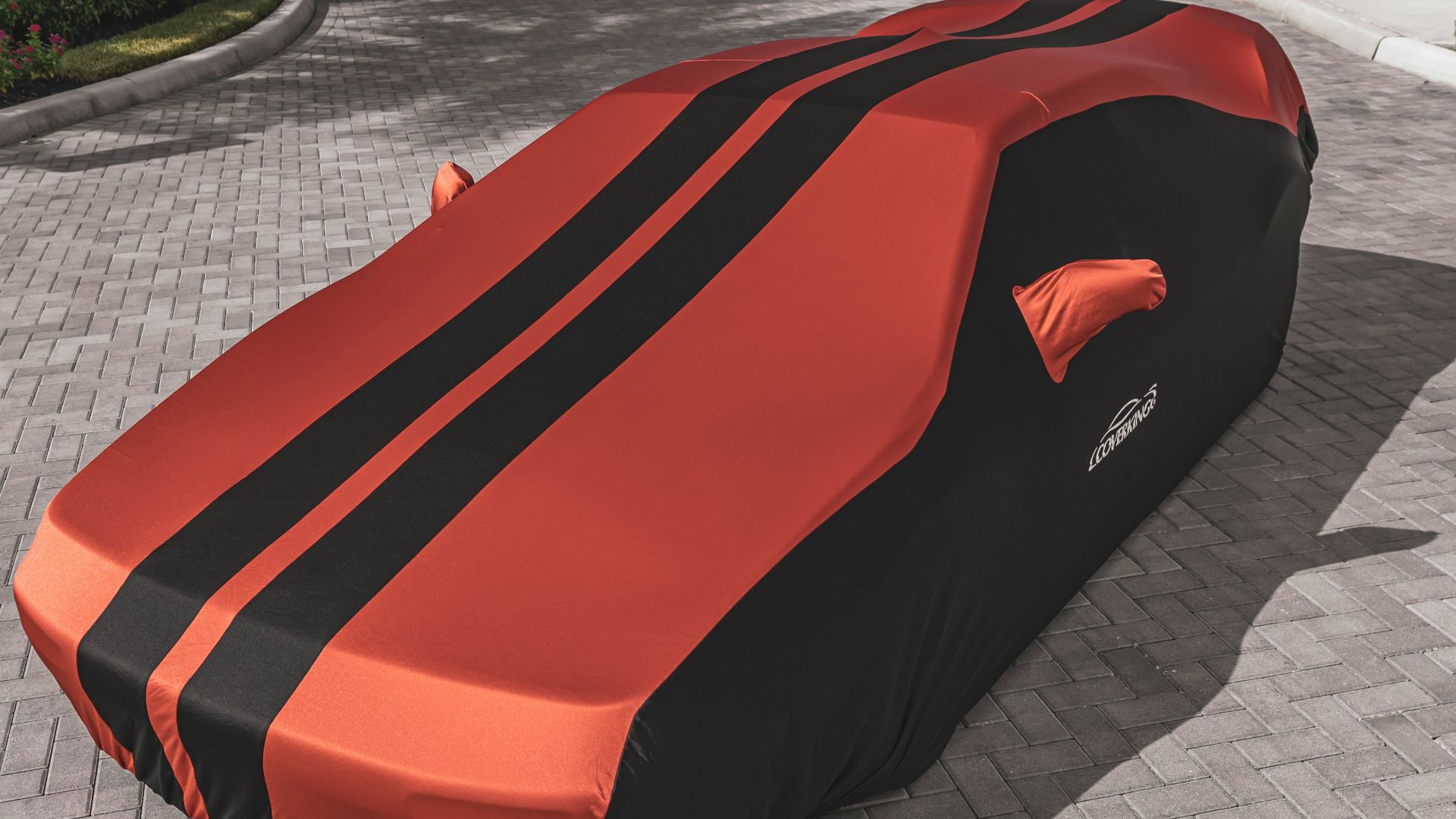 red ferrari car on gray concrete pavement