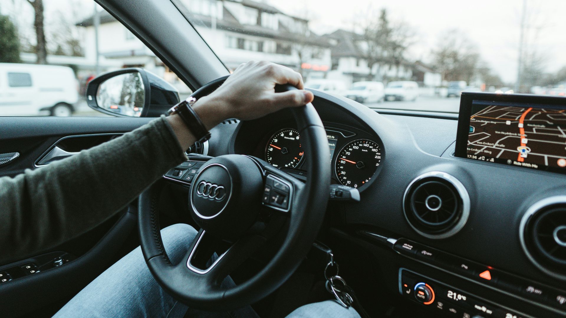 person driving car during daytime