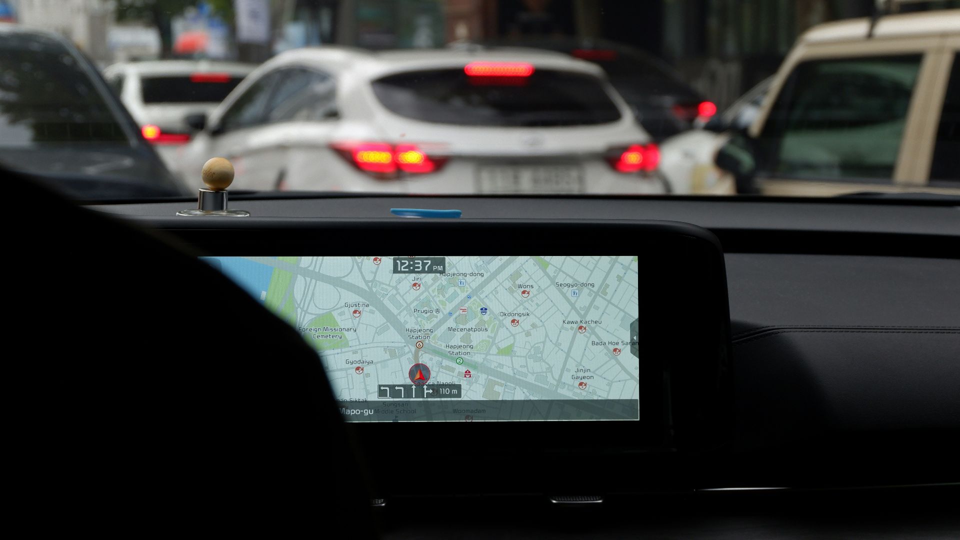 A car with a gps device on the dashboard