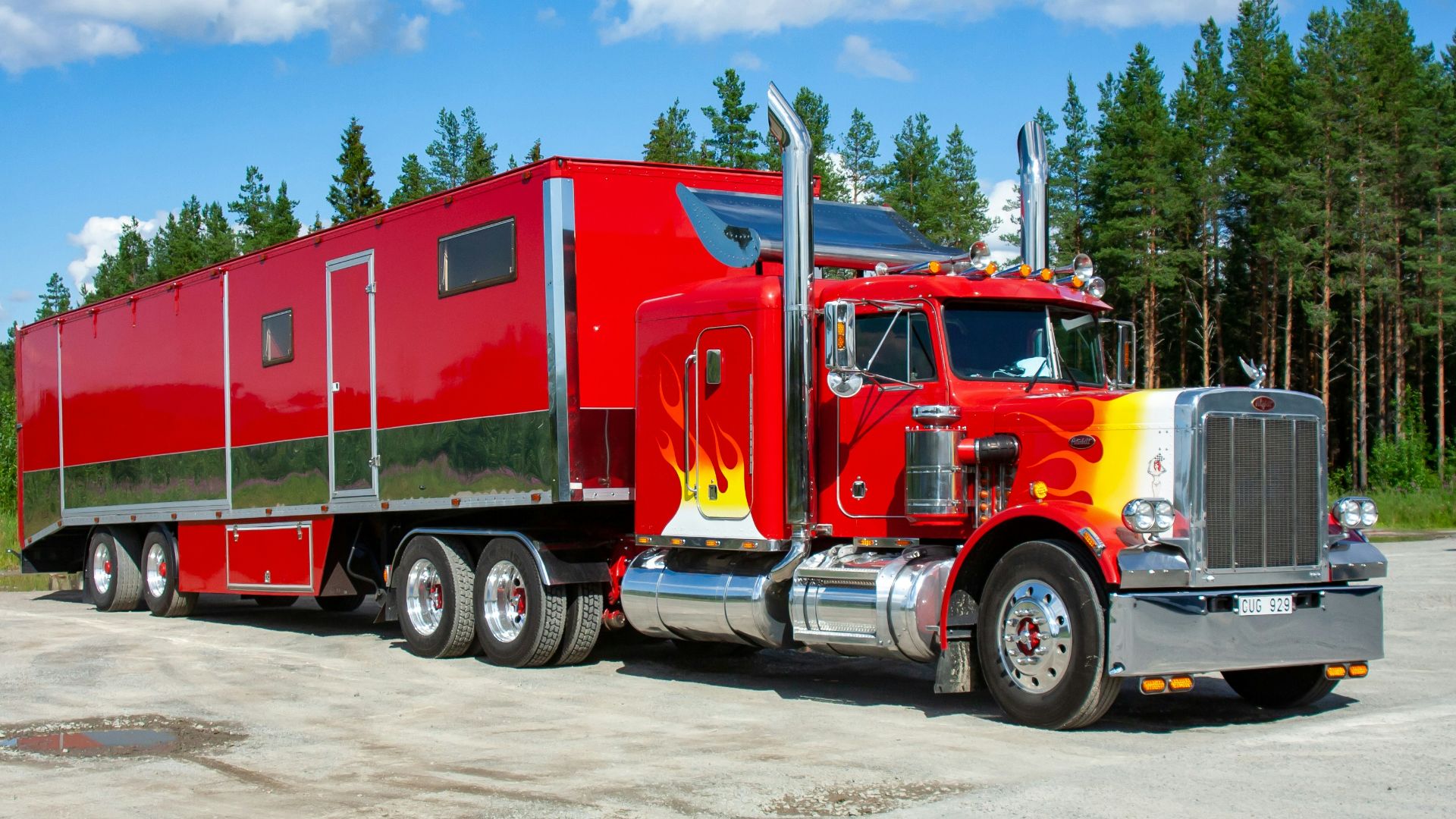 red and white truck on road during daytime