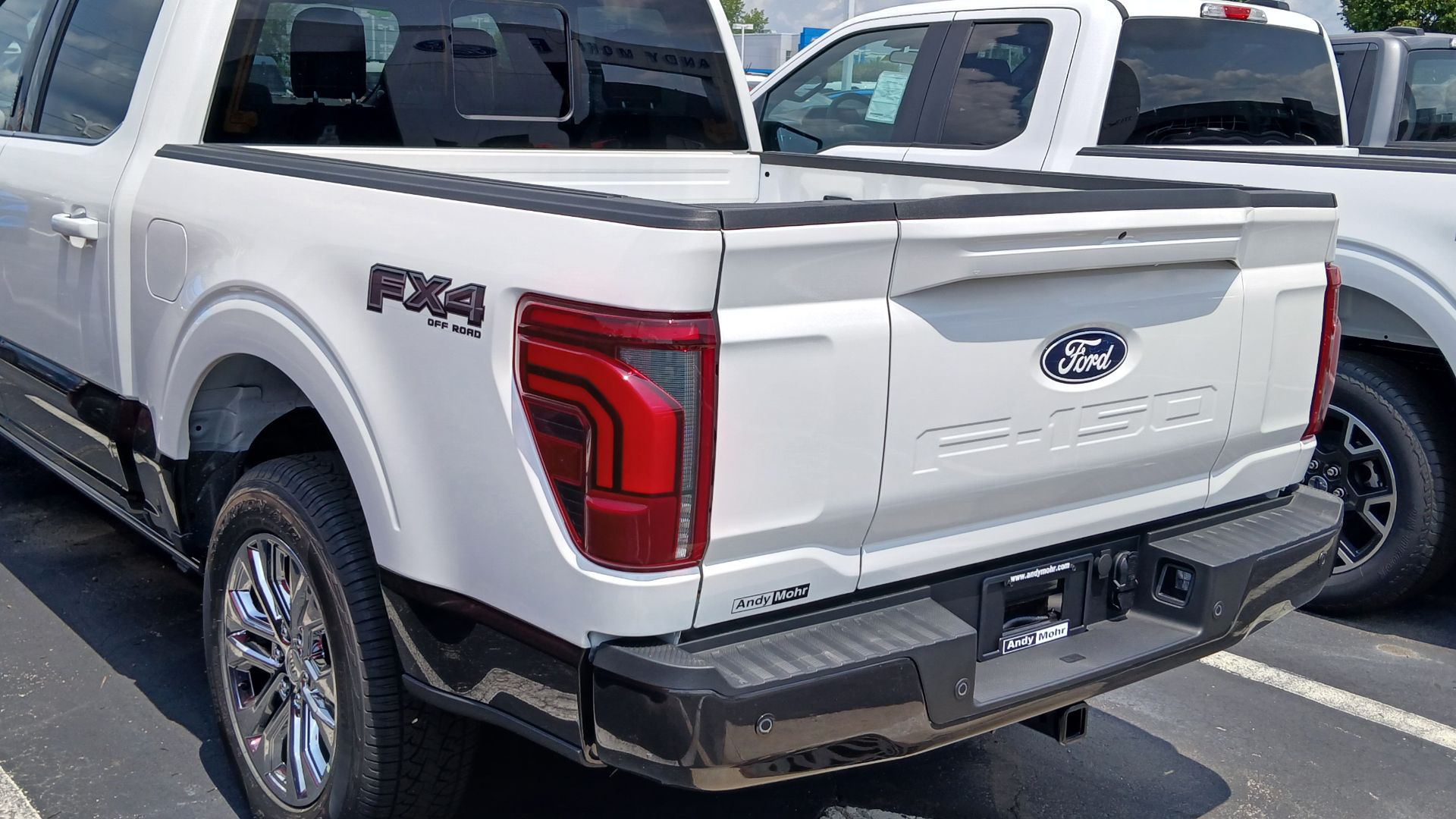 Rear view of a 2024 Ford F-150 King Ranch SuperCrew PowerBoost pickup truck.