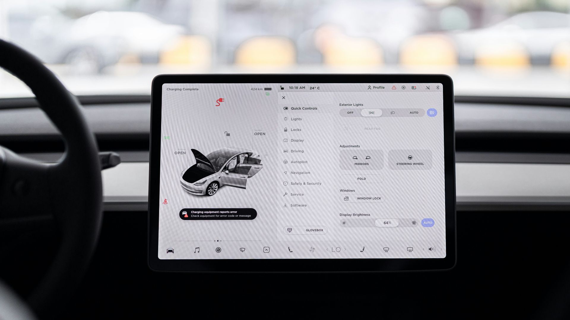 a person holding a tablet in a car