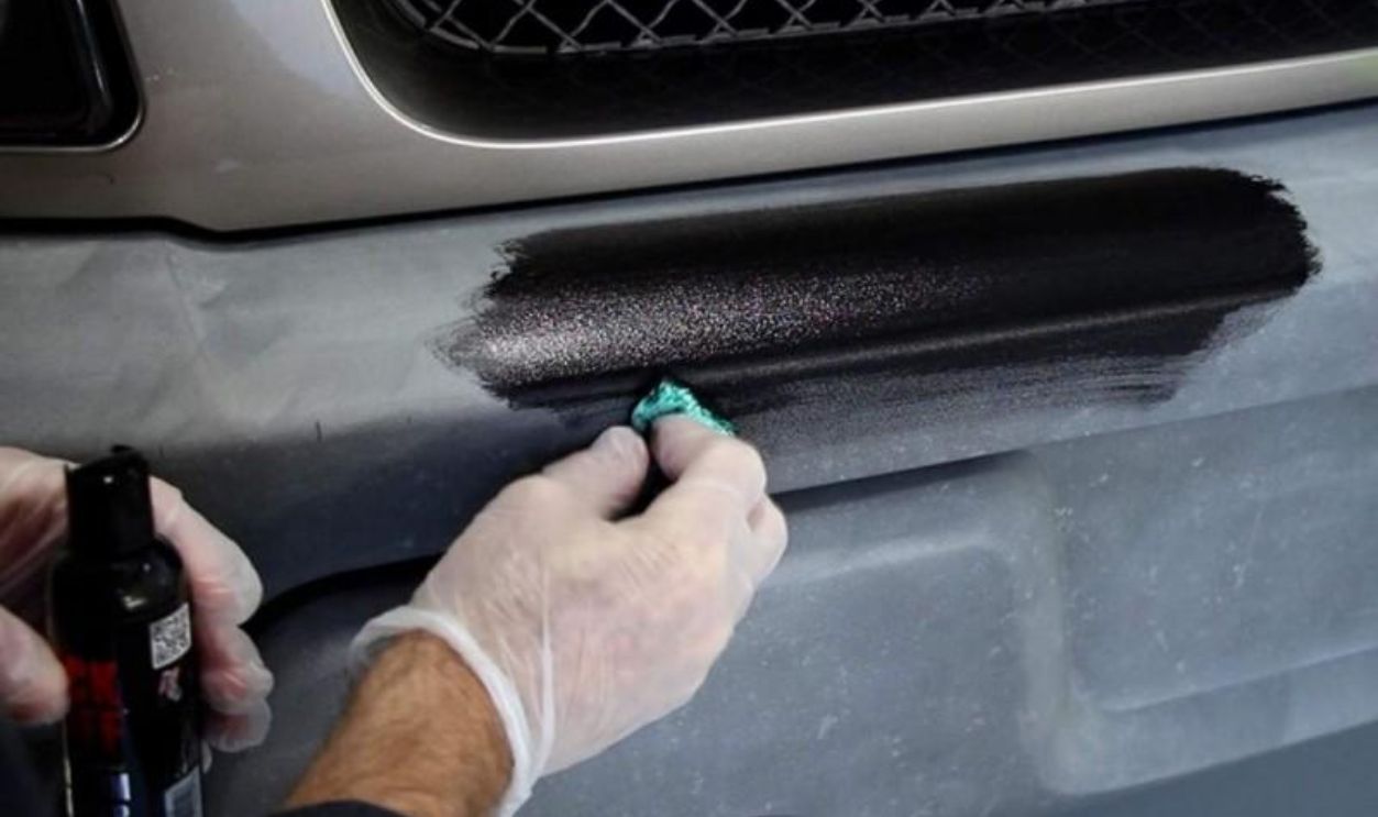 A person applying a trim restoration