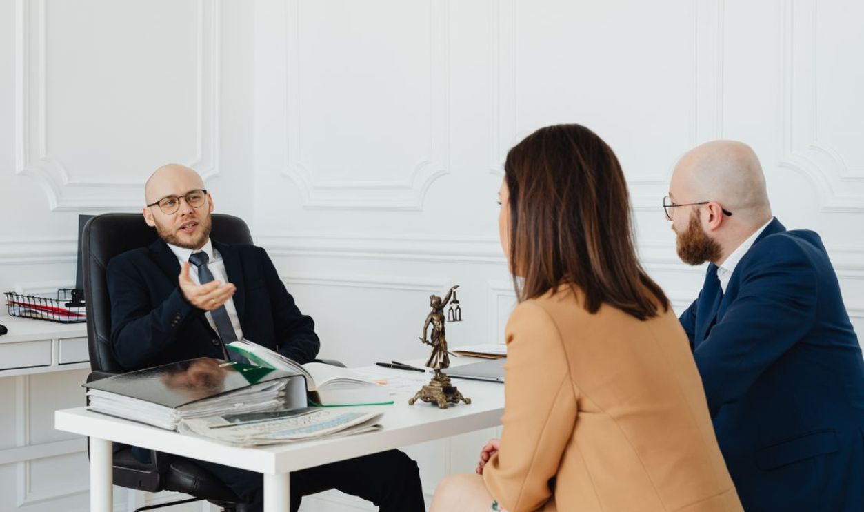 Couple Talking to A lawyer