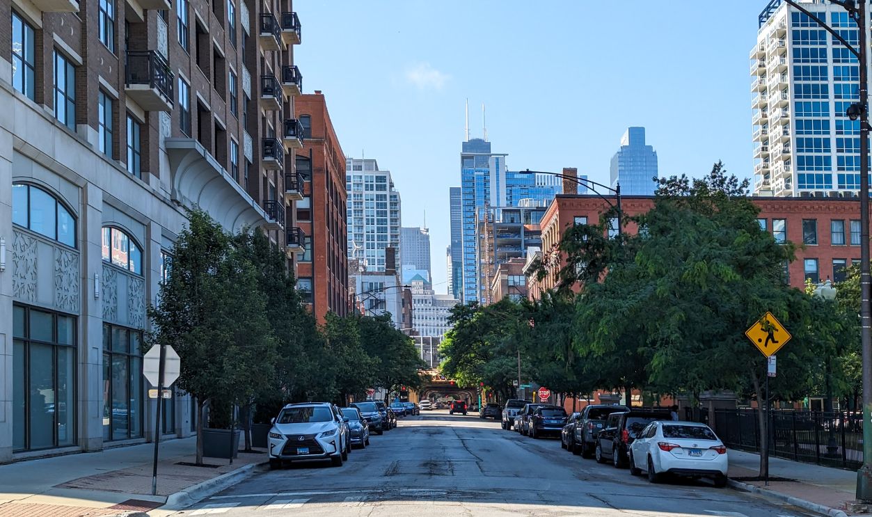 Street view in Chicago showcasing urban architecture and iconic skyline on a clear day