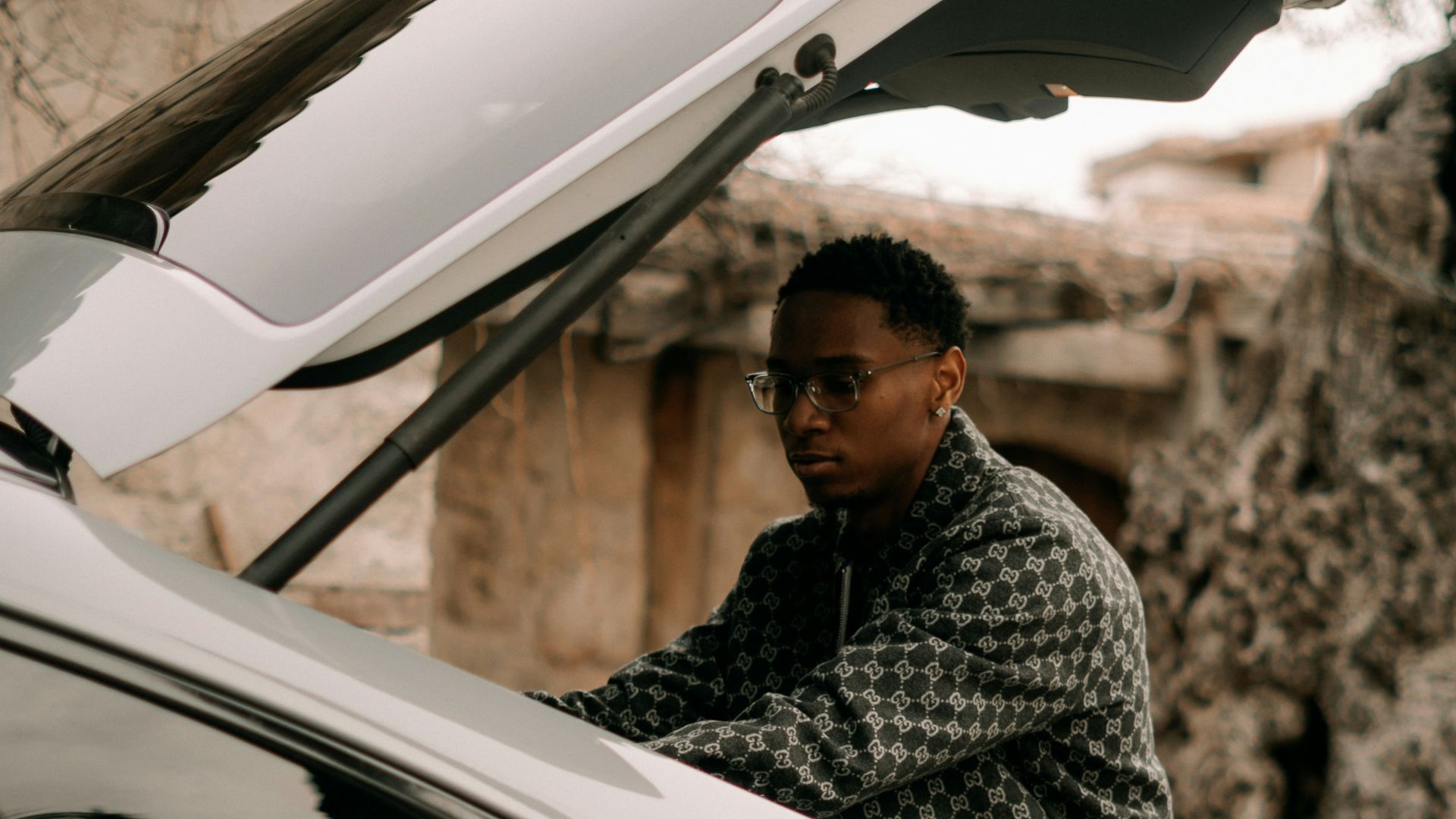 Man loading items into the trunk of a car