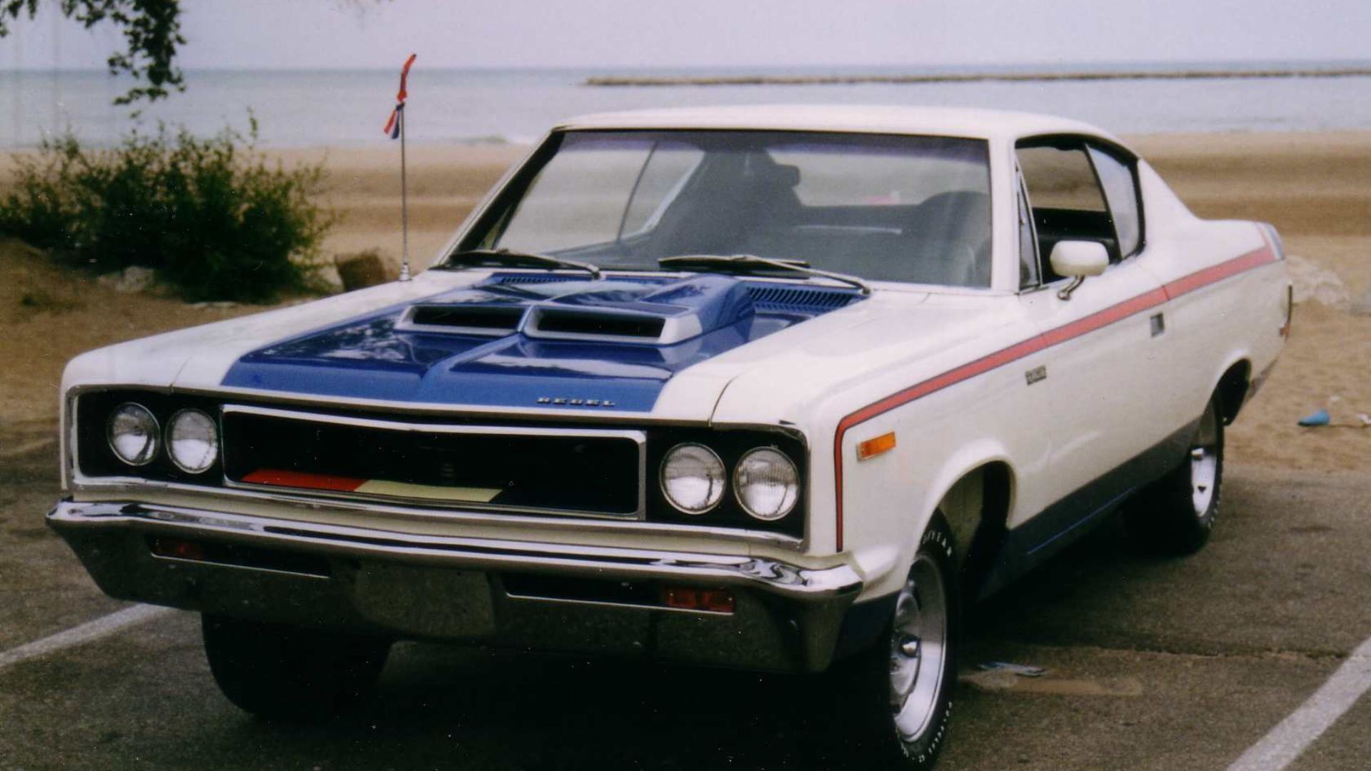 American Motors Corporation (AMC) 1970 Rebel two-door hardtop (coupe) - The Machine, a traditional mid-size U.S. muscle car finished in the factory red/white/blue trim.photograph taken in Kenosha, Wisconsin - in the park overlooking Lake Michigan.