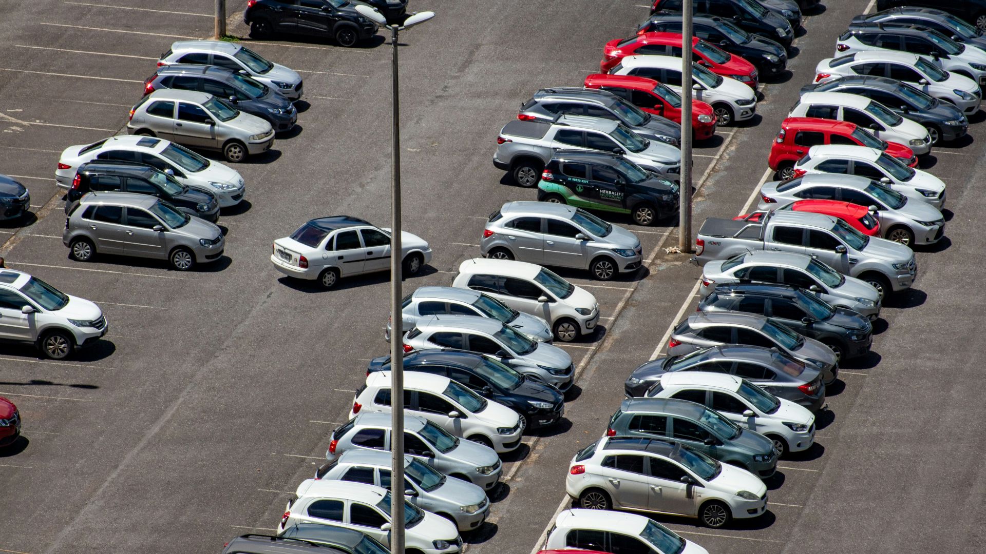 cars parked on parking lot during daytime