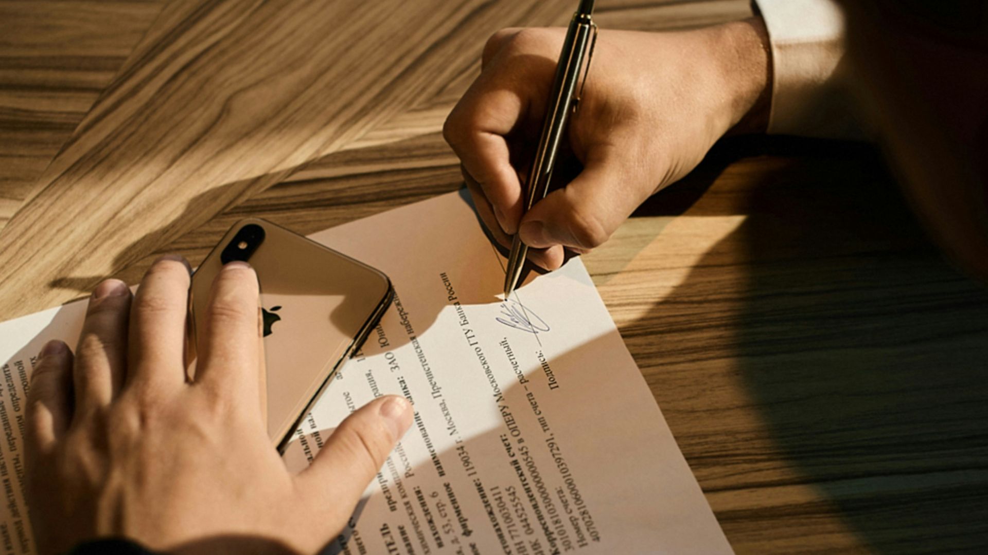 person writing on white paper