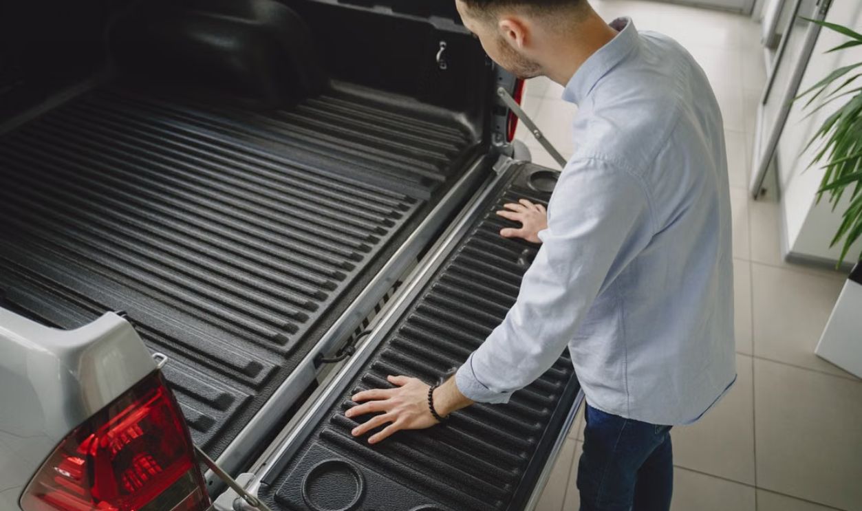 Adult man examines tailgate