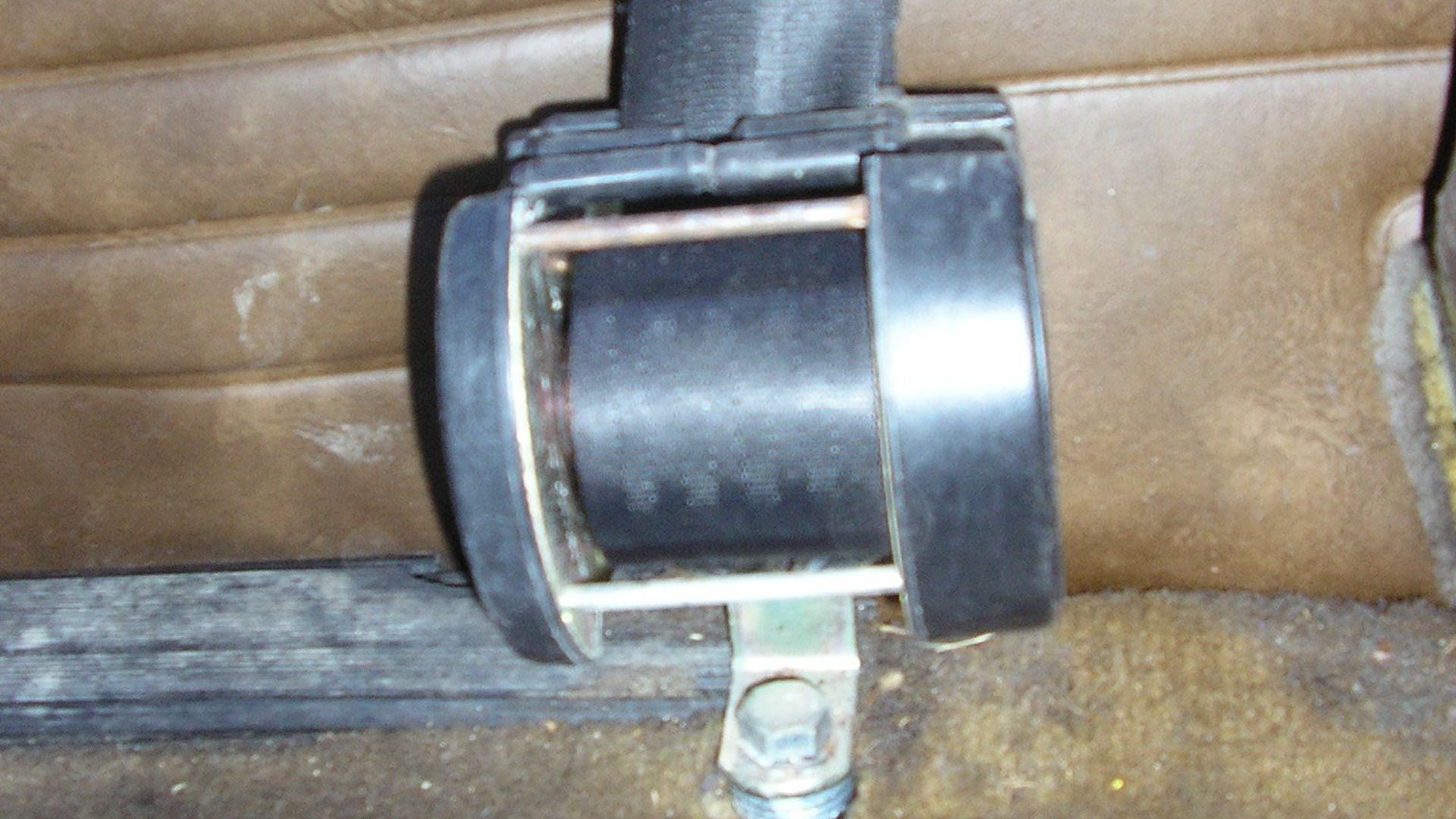 Inertial reel belt (with roll exposed), retrofitted in a 1973 SAAB 99L.