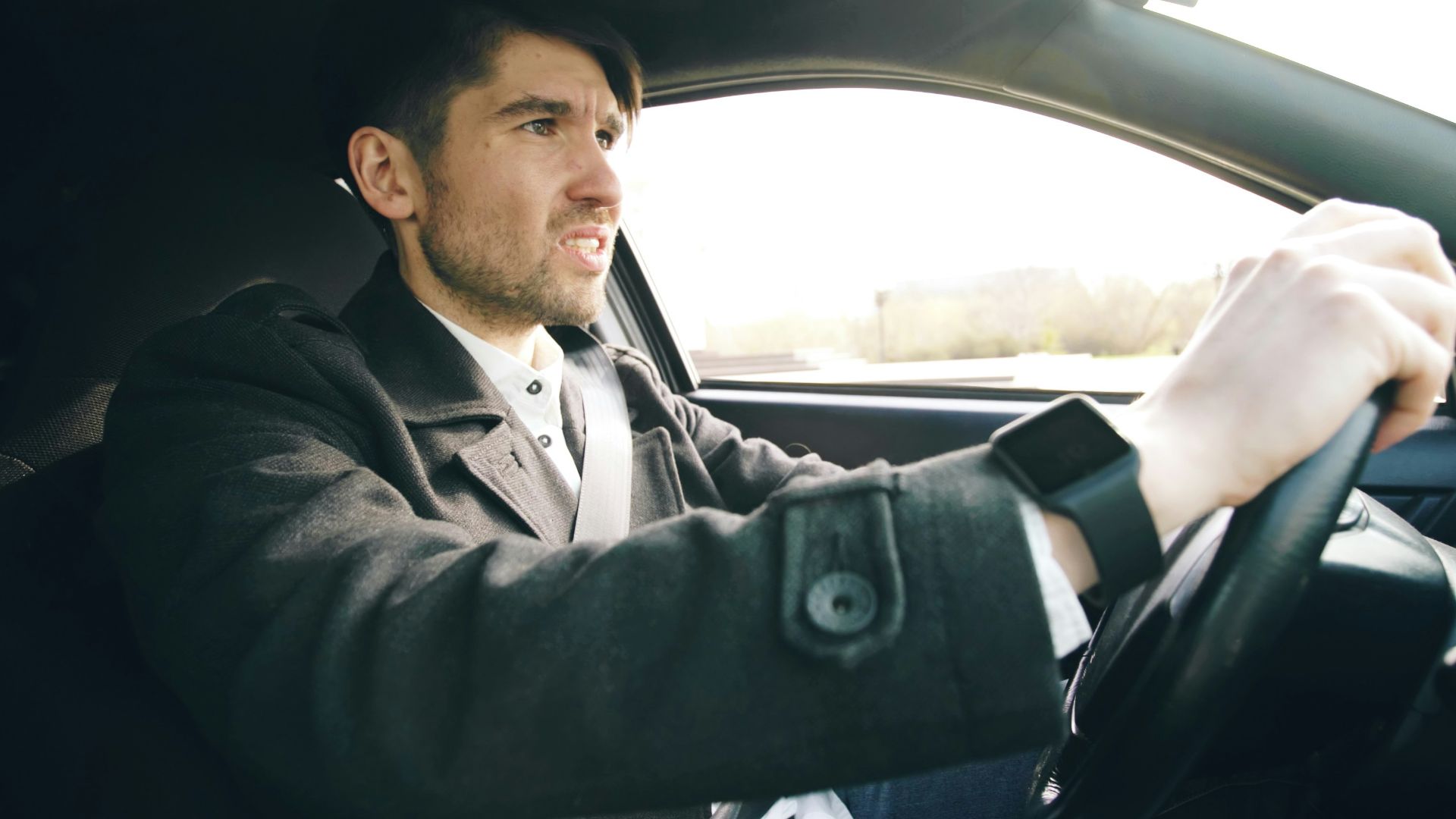 Man driving a car with intensity