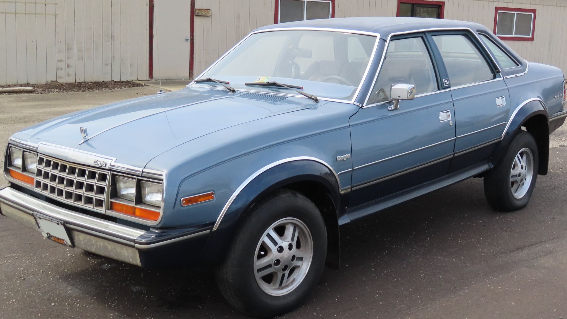 1981-1984 AMC Eagle 4-door sedan photographed in New Castle, Pennsylvania. This one is a base model finished in Medium Blue Metallic. Eagles themselves are becoming increasingly scarce, but the 4-door sedan has always been much harder to come by than the 