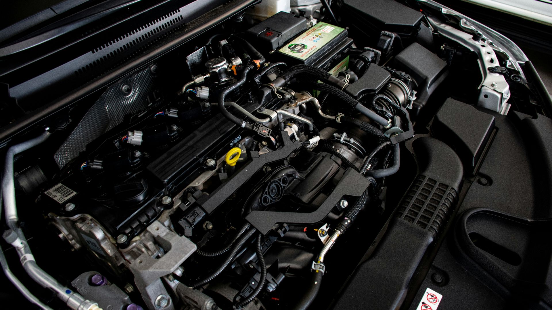 the engine compartment of a car with its hood open