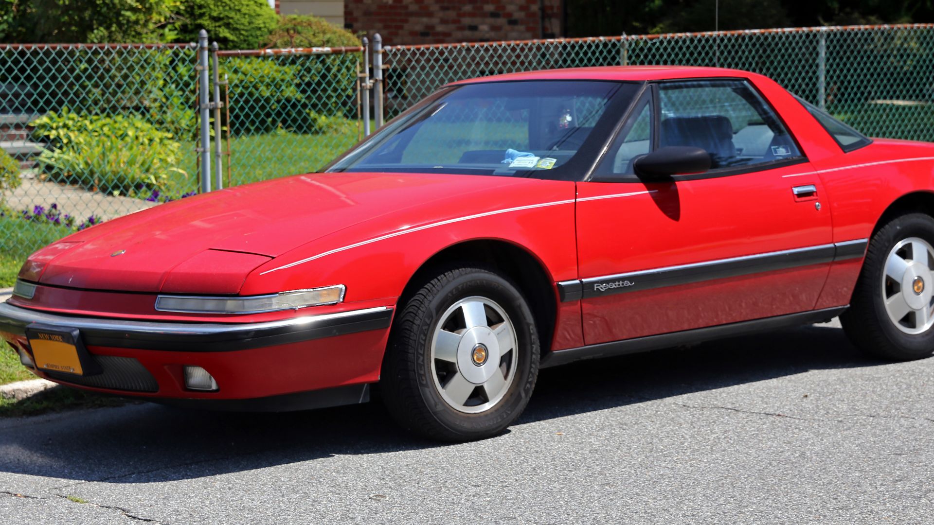 A 1988 Buick Reatta. 4-spd auto and 3.8 litre V6, as per all Reattas.
