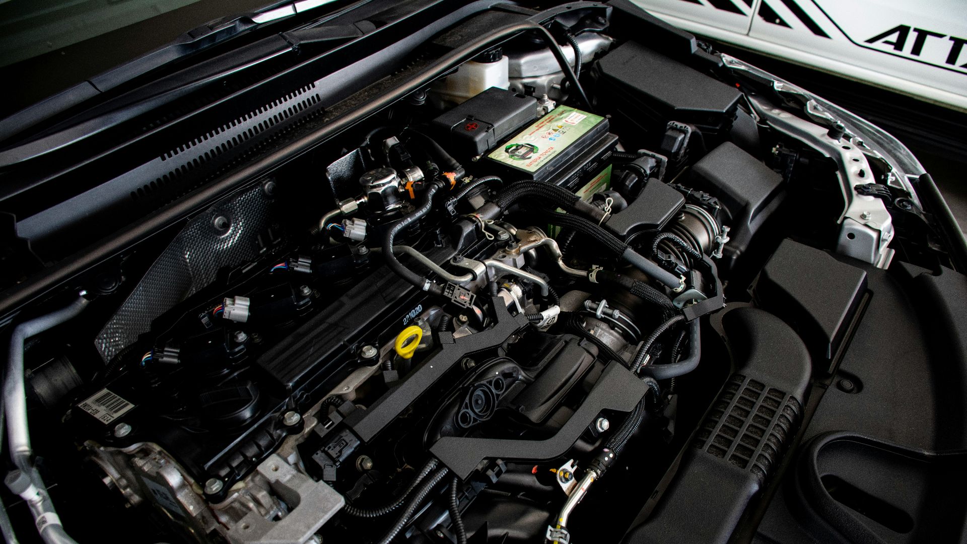 the engine compartment of a car with its hood open