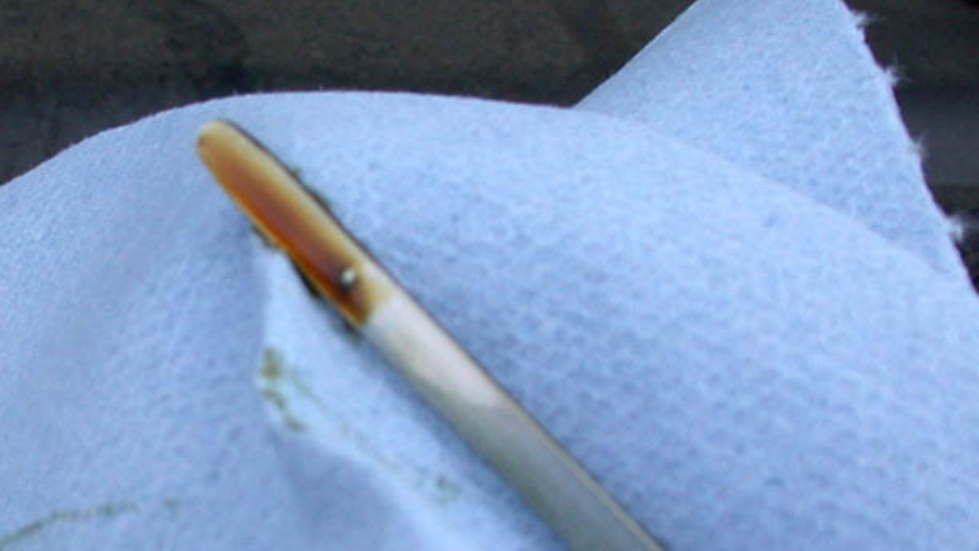 Dipstick for measuring the level of motor oil in an automobile.