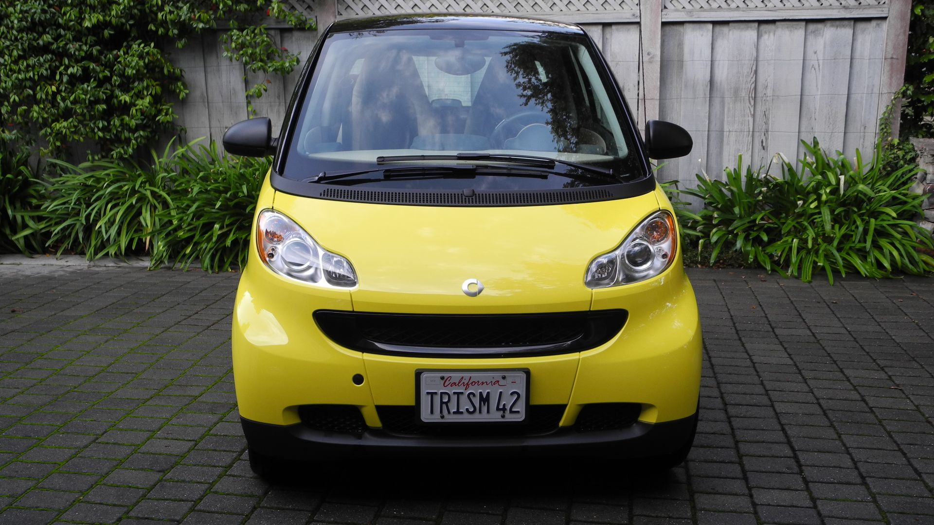 The pictures show a Smart Car with customized (or