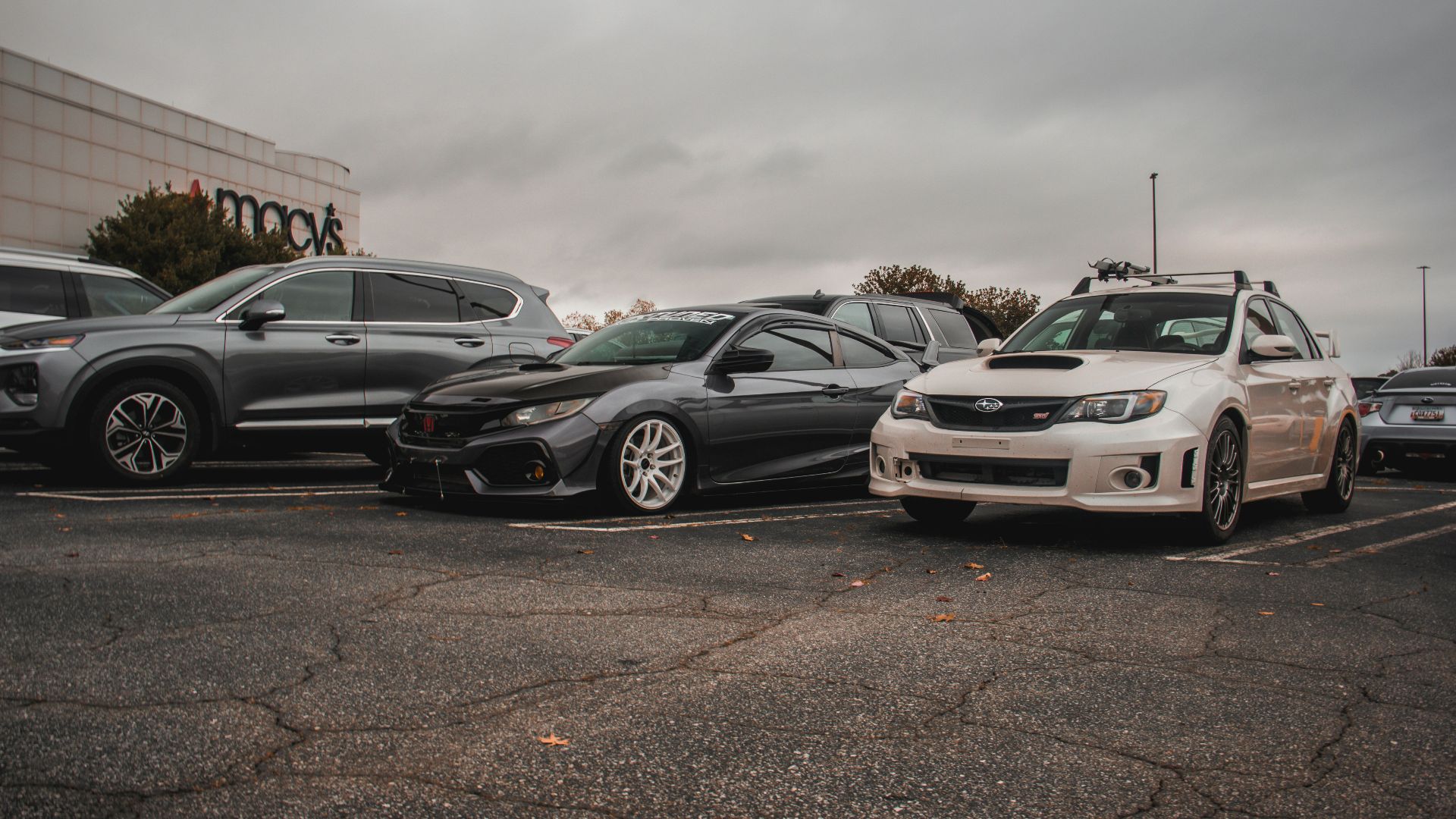 a group of cars parked in a parking lot