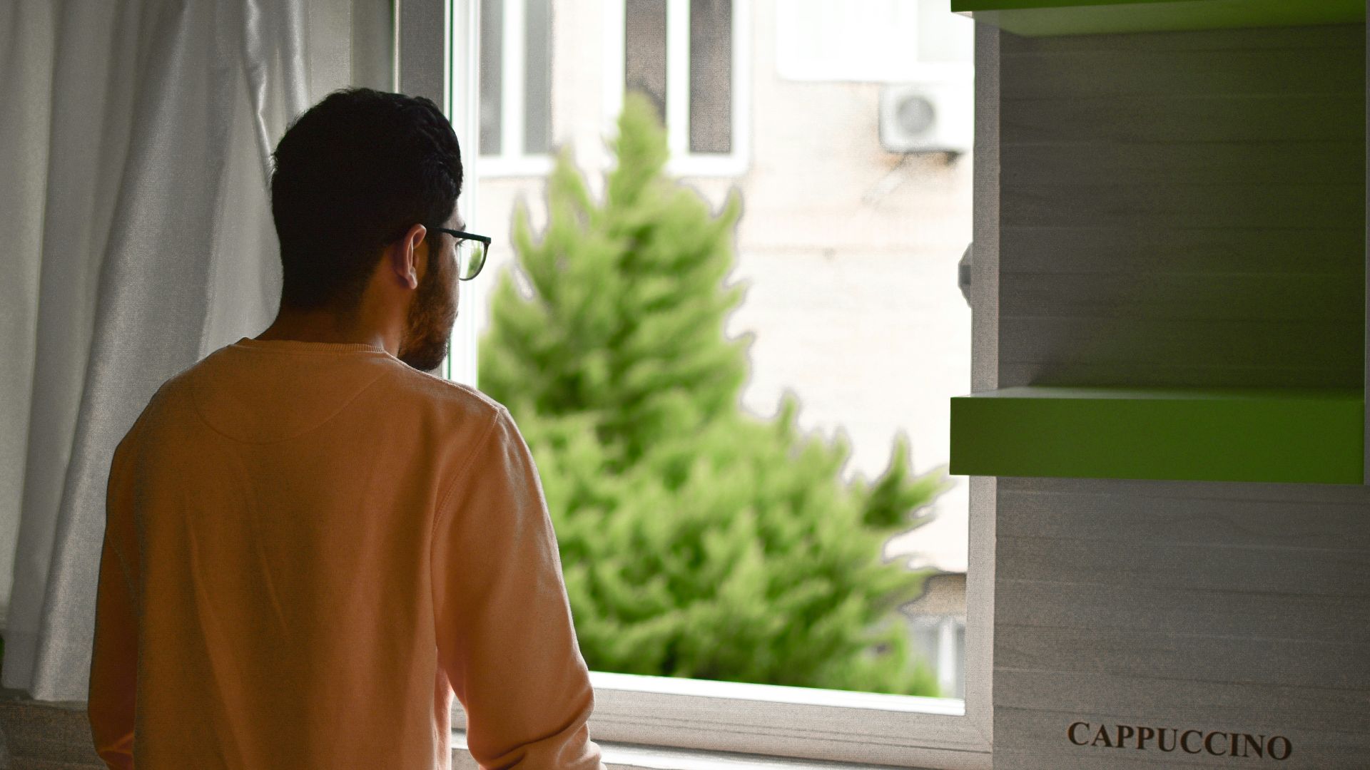 a person looking out a window